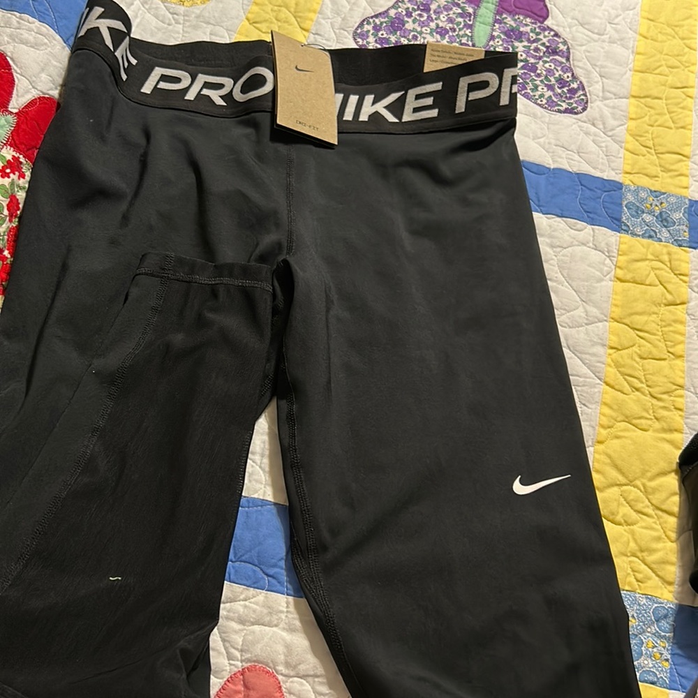 Solid Black Nike Pro leggings. New with tag.  Excellent condition